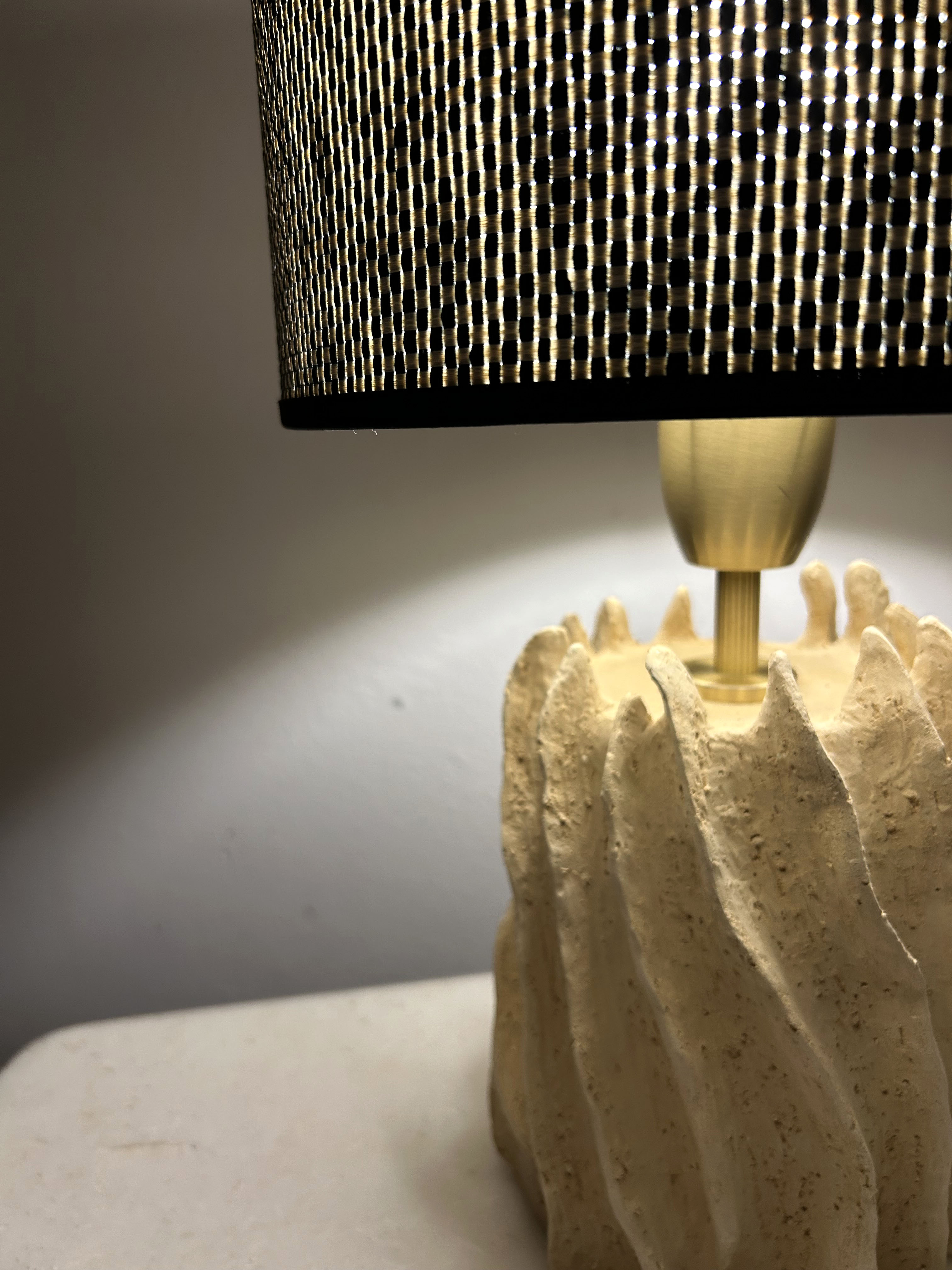 Detail of organic ceramic lamp base and woven shade